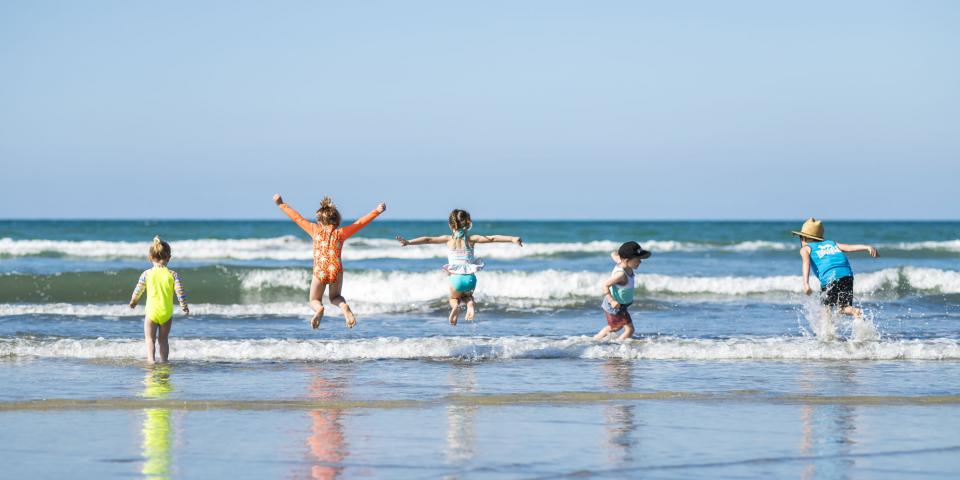 Kids playing on Ōhope Beach