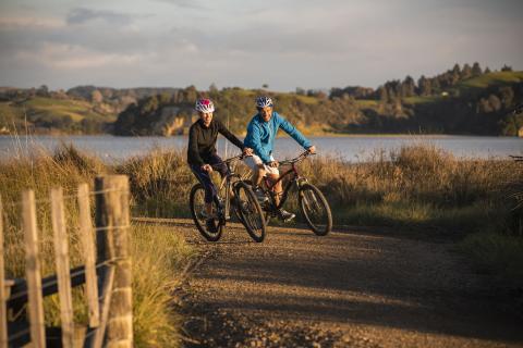 Cycling couple on trail