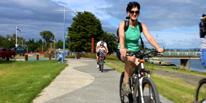 Family Biking on Warren Cole Walkway