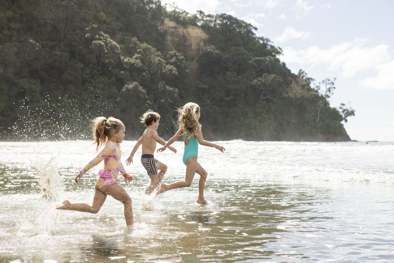 Three kids enjoying the beach