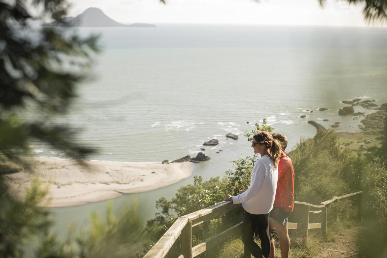 Couple looking out at coastal view