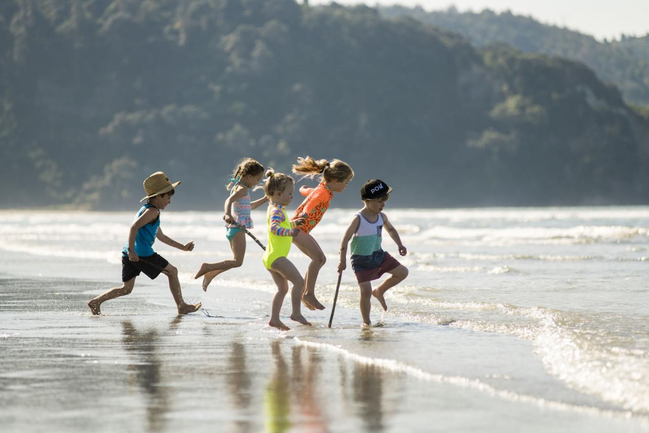 Kids playing on Ohope beach