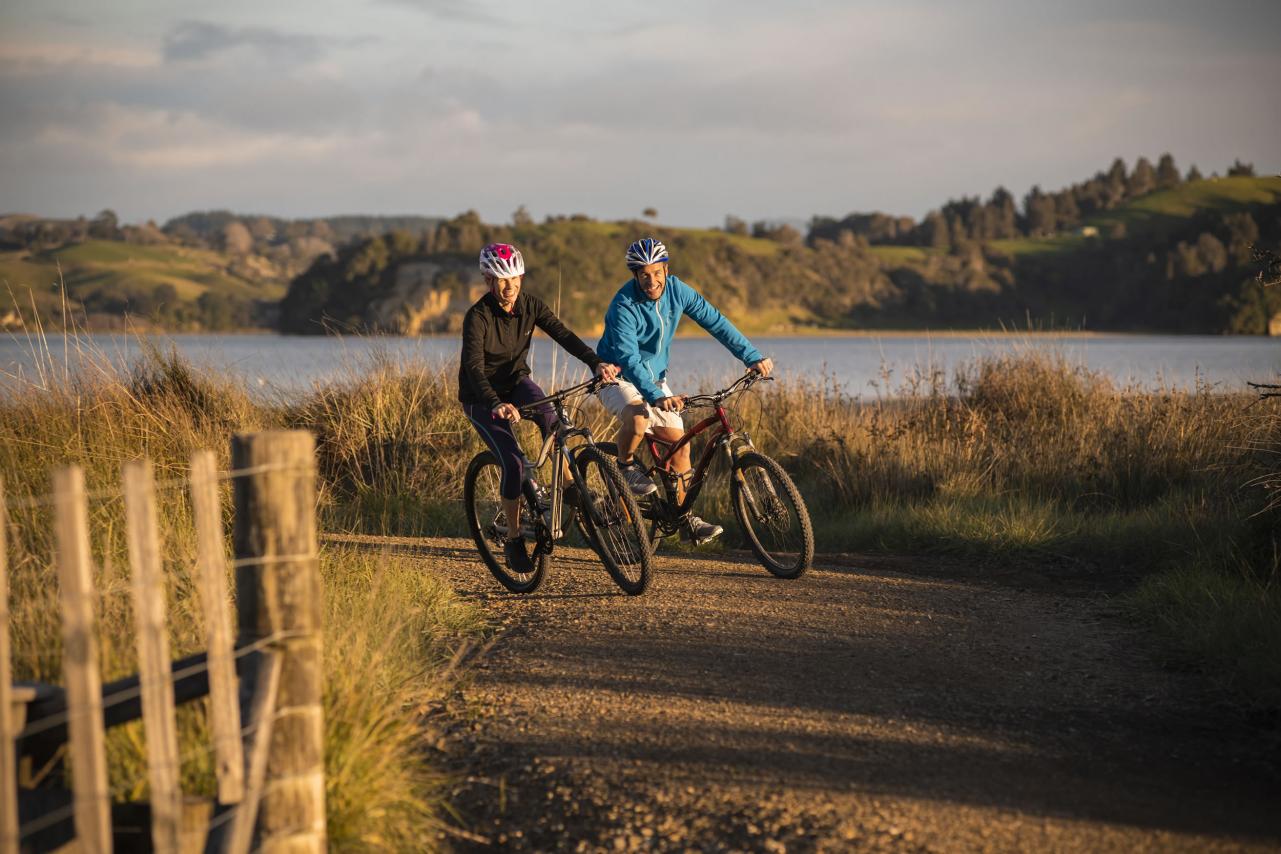 Cycling couple on trail