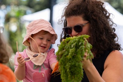 Mum and Baby picking fresh carrots