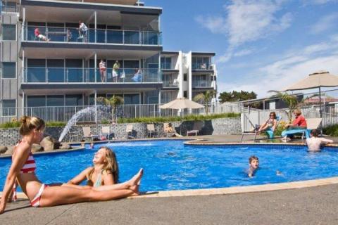 People lounging by the pool