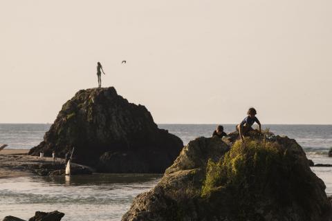 Kids climbing rocks at the heads