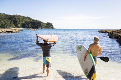 Friends going out for a SUP